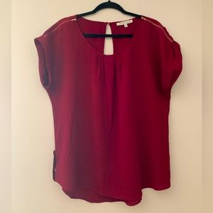 Burgundy shirt sleeve blouse. Zipper sleeve detail and side button detail.